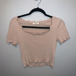 Cropped beige top.